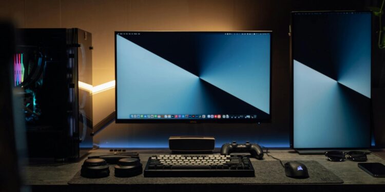 Illegal crypto mining setup with hardware and computers in a dimly lit room.