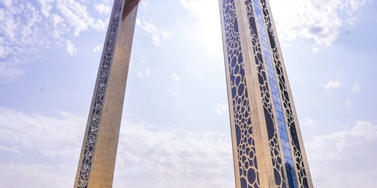 A skyline view of Dubai with cryptocurrency symbols overlay, highlighting regulatory changes.
