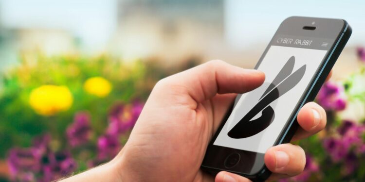 Bitfarms logo displayed on a digital screen with cryptocurrency graphics in the background.