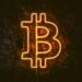 Bitcoin symbol with gaming elements, symbolizing financial innovation in the gaming industry.
