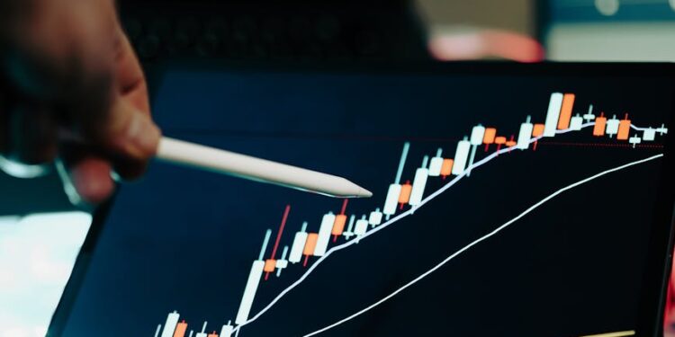 A digital wallet displaying Bitcoin graphics and stock market trends.