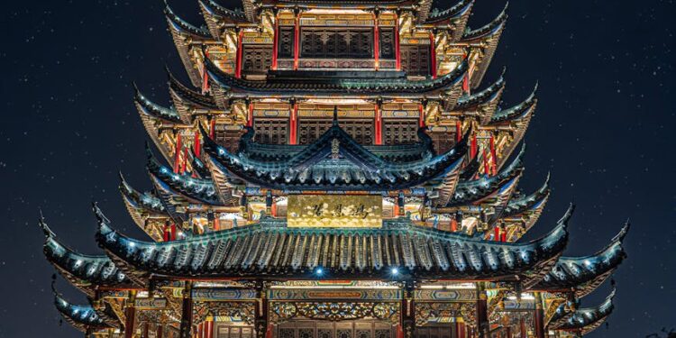 China's central bank building with gold bars, symbolizing extended gold purchases.