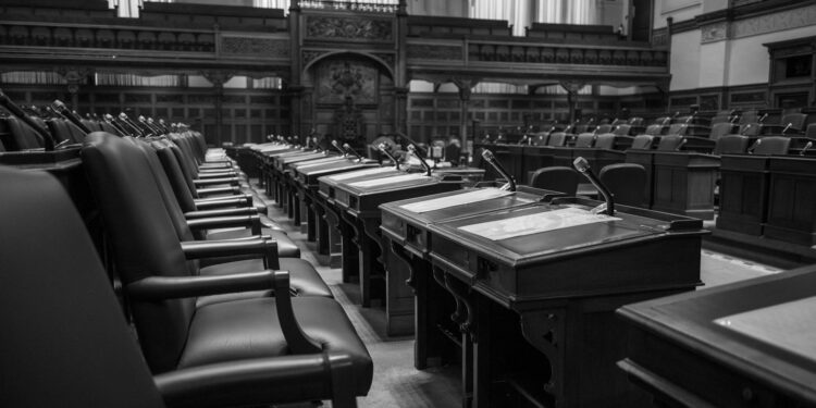 Florida lawmakers discuss cryptocurrency regulations in a legislative chamber.