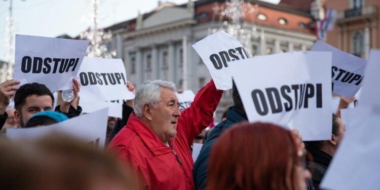 Investors gather, holding signs demanding refunds amid Trove's shift to Solana blockchain.