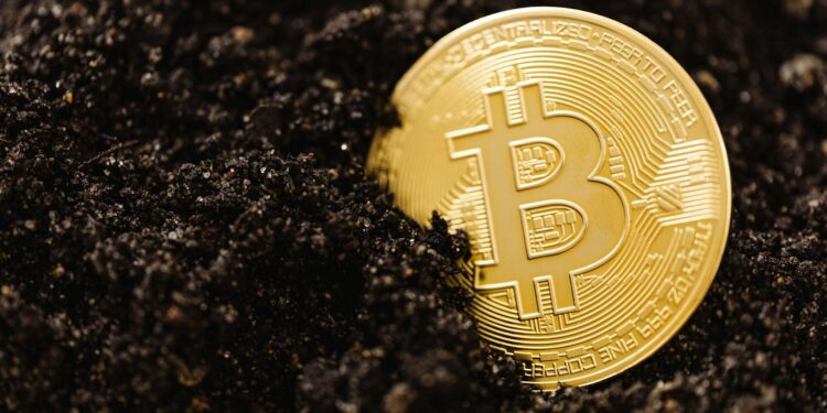 Snow-covered mining rigs with blinking lights, illustrating Bitcoin mining disruption during winter storm.