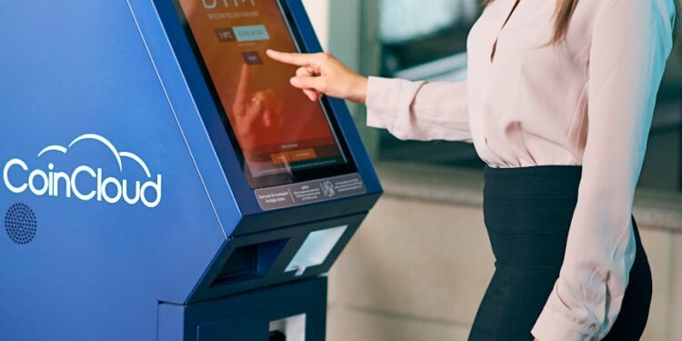 A bank teller assisting customers with cryptocurrency transactions at a financial institution.