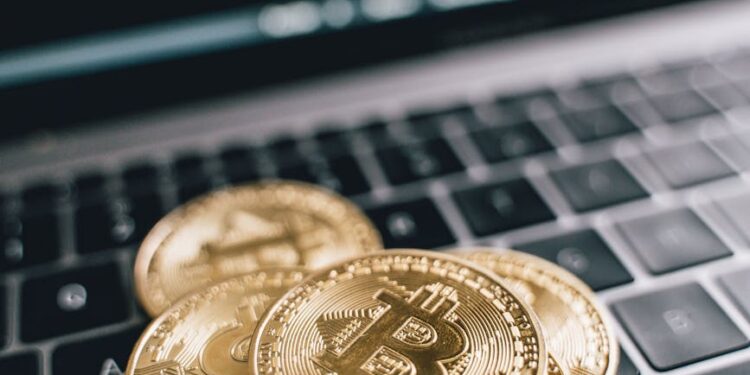 Bitcoin coins stacked with a backdrop of financial graphs and debt reduction symbols.