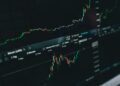 A graph showing declining Bitcoin ETF inflows with a backdrop of financial charts.