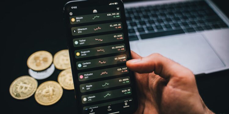 Tether logo superimposed on a background of Bitcoin coins and financial graphs.