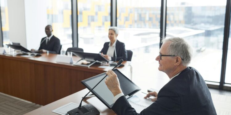 Bhutan officials discussing Sei Validator and tokenization in a futuristic conference setting.