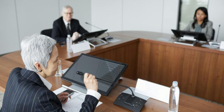 Strive Inc. executives discussing cryptocurrency strategy in a boardroom.