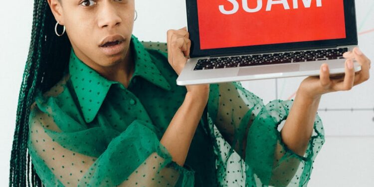 Trust Wallet logo displayed on a computer screen with a warning message about Chrome extension removal.