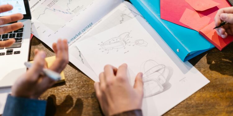 Business meeting with financial charts and graphs related to funding and valuation growth.