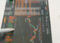 Graph showing XRP price increase, trading volume spikes, and financial data analysis.