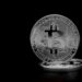 Two logos for Coinme and Sequence on a digital background with cryptocurrency symbols.