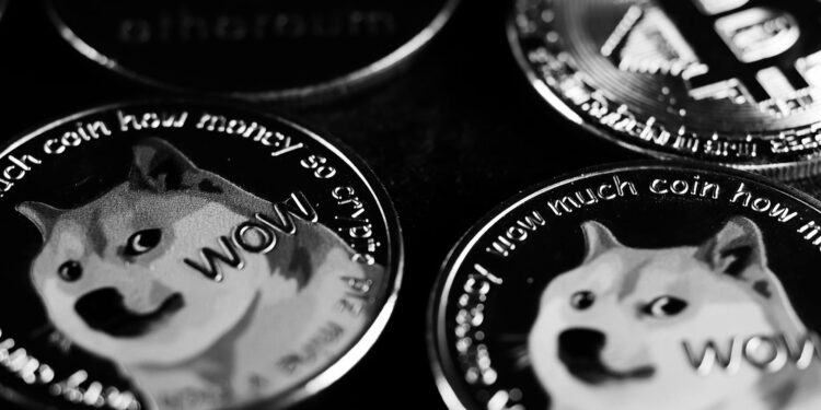 Investors review cryptocurrency charts as Grayscale Ethereum Staking ETF rewards are announced.