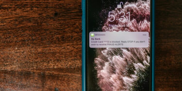 A digital wallet showing USDC and a notification about a security breach.