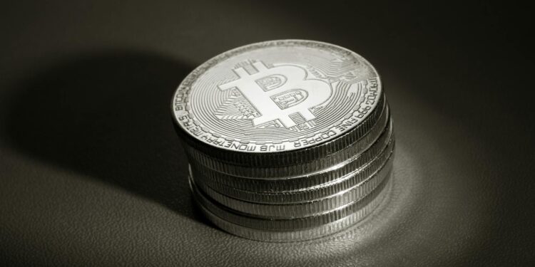 Bitcoin and Solana logos with stock market graphs, symbolizing ETF filings by Morgan Stanley.