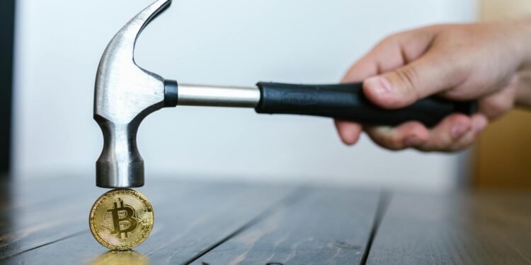 Cryptocurrency symbols overlaid with a digital lock, representing ransomware threats.