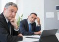 MrBeast and BitMine executives discuss investment strategy in a modern office setting.