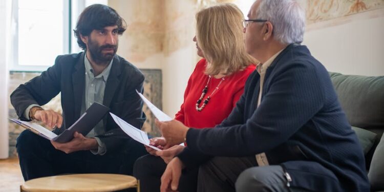 A financial advisor discussing Bitcoin investment options with interested clients.