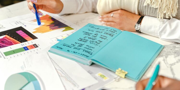Jerome Powell speaking at a press conference, surrounded by financial data graphics.