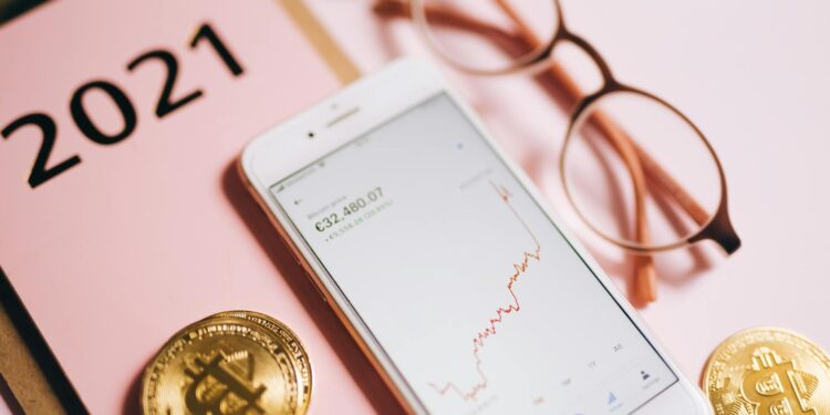 Investors discussing cryptocurrency trends with digital assets on screens in the background.