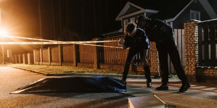 Police investigating a cryptocurrency ransom kidnapping case with seized digital devices.