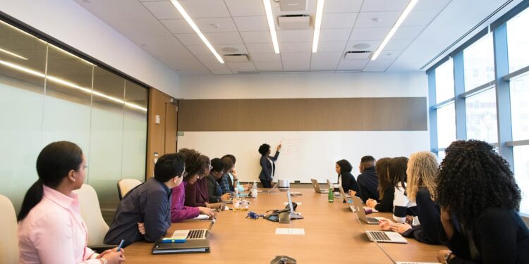 Four diverse professionals discuss stablecoin trials at a fintech conference.