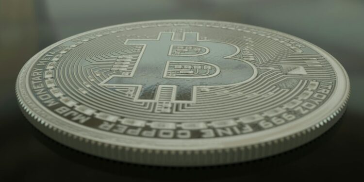 A whale icon with Bitcoin symbols and a Binance logo, highlighting a large BTC transfer.