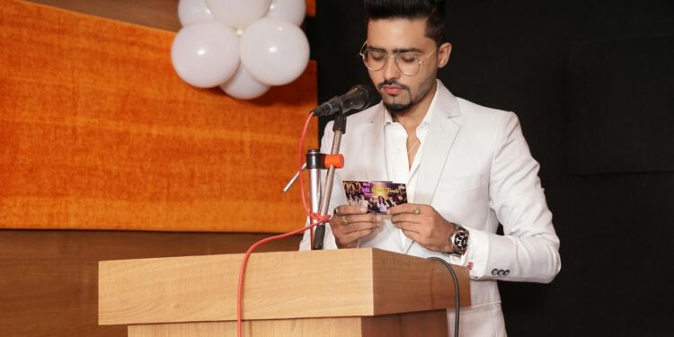Trump speaking at a podium with federal agencies' logos in the background, addressing AI regulation.