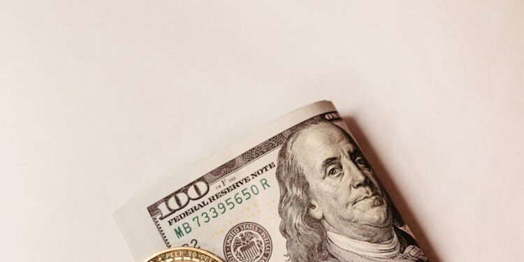 A Bitcoin coin with a dollar sign overlay and financial graphs in the background.