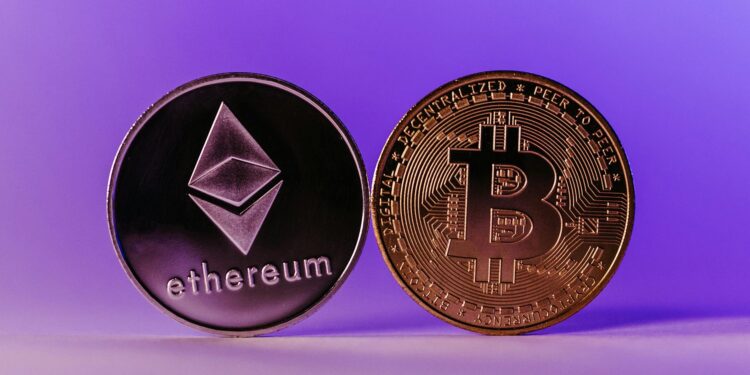 Crypto icons of Bitcoin and Ether with a vault symbol representing yield investment.