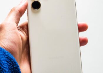 Samsung Galaxy S26 phone displayed with holographic AI interface and futuristic design.