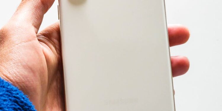 Samsung Galaxy S26 phone displayed with holographic AI interface and futuristic design.