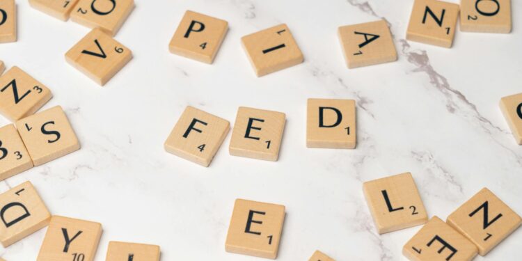 Graphic showing Federal Reserve building with financial symbols and public comment invitation.