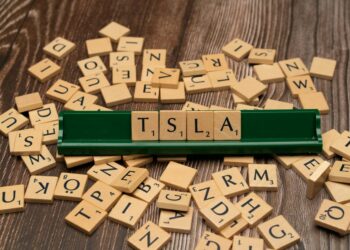 Stock market display showing Block's share price rising amid announcements of job cuts.