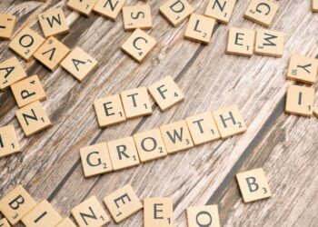 Bitcoin and ETF symbols overlaid on a financial graph illustrating capital inflow.