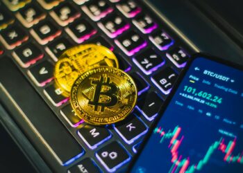 A person managing digital assets on a smartphone, with cryptocurrency icons in the background.