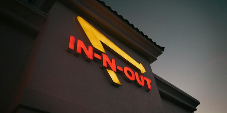 A Steak 'n Shake restaurant with a Bitcoin logo featured prominently on its signage.