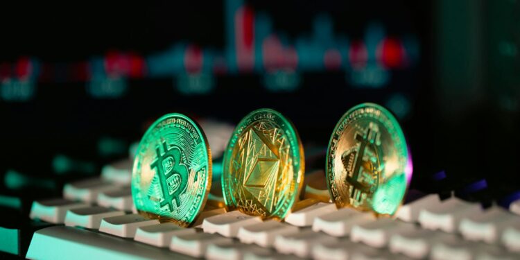 Enoch Godongwana speaking at a podium with financial charts and cryptocurrency symbols in the background.