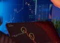 Executives shake hands in front of a digital currency trading screen, signaling partnership.