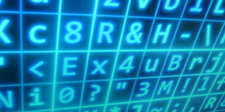 A computer screen displays code, with a Bitcoin symbol and warning signs amid cybersecurity graphics.