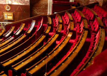 Arizona Senate chamber with lawmakers discussing digital asset regulation.