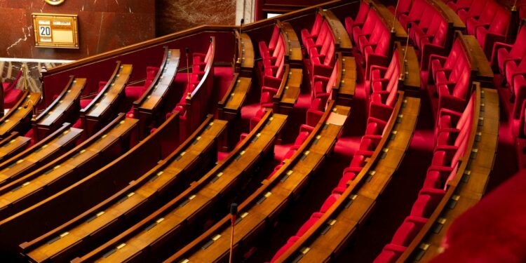 Arizona Senate chamber with lawmakers discussing digital asset regulation.