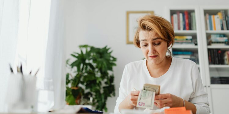 David Prinçay outside Binance France office with a concerned expression amidst security presence.