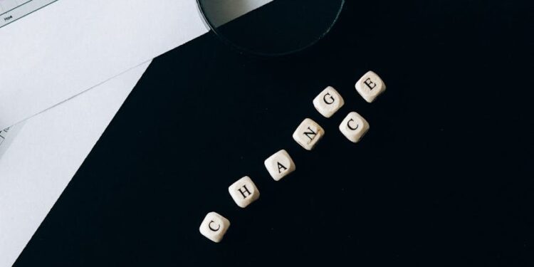 A person examining cryptocurrency symbols with a financial regulation document nearby.