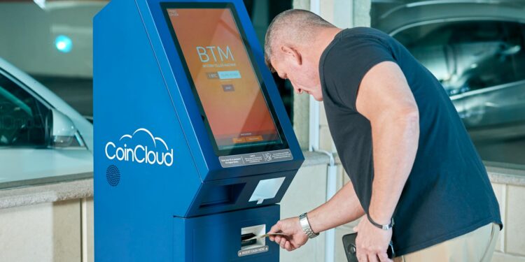 Bitcoin ATM screen displaying ID verification prompt amidst currency exchange graphics.