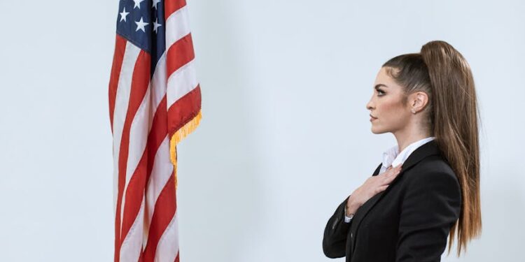A government official discusses AI chatbot regulations at a podium with the UK flag in the background.