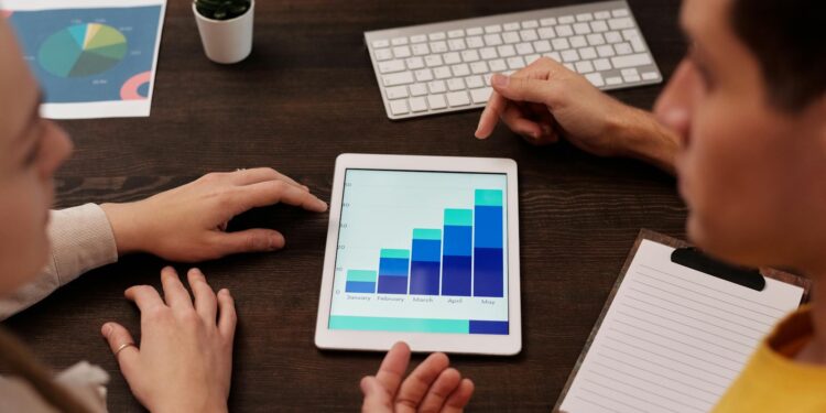House committee members discussing financial regulations with graphs and charts on screen.